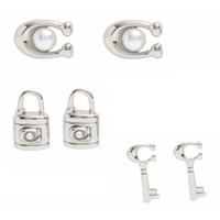 COACH BOXED SIGNATURE LOCK KEY EARRINGS SET SILVER OF THREE (3) CO293