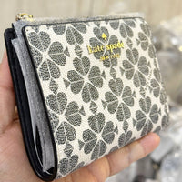 KATE SPADE NEW YORK SPADE FLOWER PVC COATED CANVAS SMALL BIFOLD WALLET KG493 IN BLACK