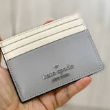 KATE SPADE MADISON SMALL SLIM CARD HOLDER IN PLATINUM GREY MULTI KC516