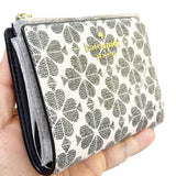 KATE SPADE NEW YORK SPADE FLOWER PVC COATED CANVAS SMALL BIFOLD WALLET KG493 IN BLACK